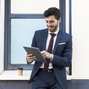 front-view-lawyer-looking-his-tablet